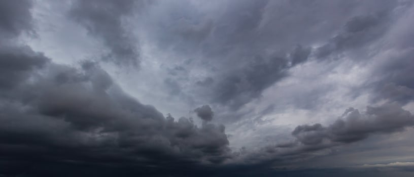 Bad or moody weather sky and environment. carbon dioxide emissions, greenhouse effect, global warming, climate change. The dark sky with heavy clouds converging and a violent storm before the rain. photo