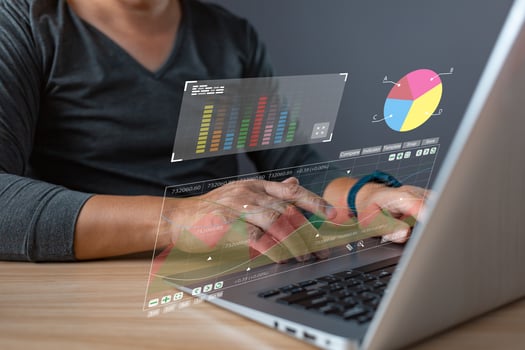 Businessman uses digital market analytics, graphs, and financial reports to strategize investments and plan for business success, leveraging technology to achieve goals and drive stock growth. photo