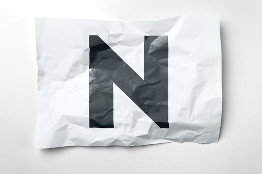 Grunge wrinkled paper letters on white background photo