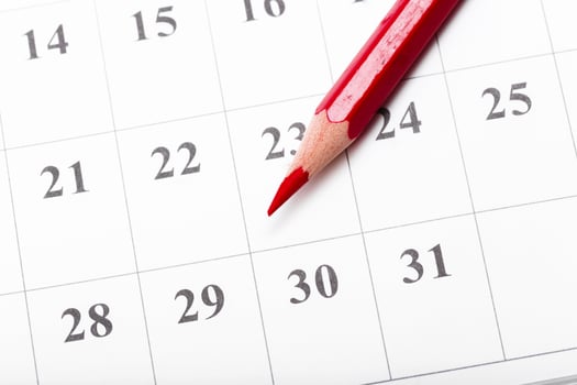 Check out the dates in a business calendar concept photo