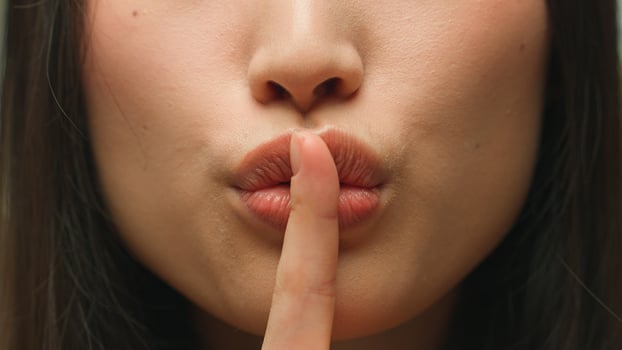 Silence gesture extreme close up female mouth Asian chinese korean japanese woman unrecognizable lady girl hush lips keep secret silent whisper quite secrecy confidential mysterious model face details photo