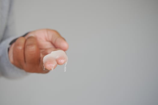 Close up of man hand using petroleum jelly photo