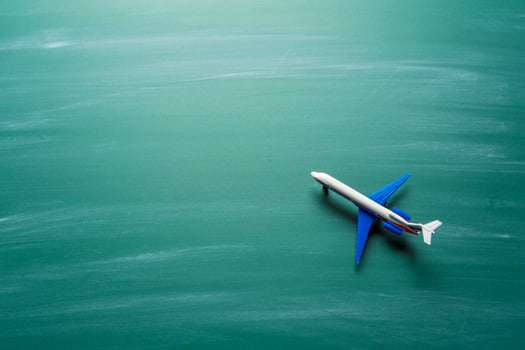 toy airplane over chalkboard background photo