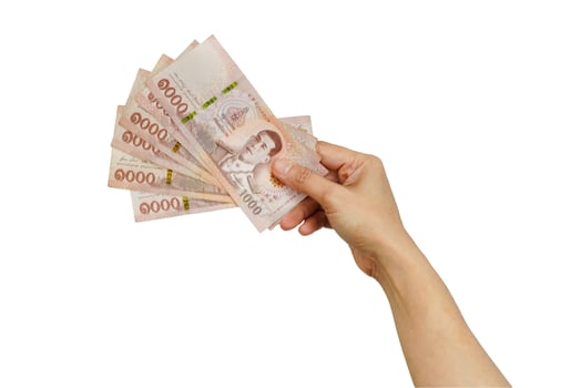 Asian woman holding Thai baht banknote money in hand isolated on white background. photo