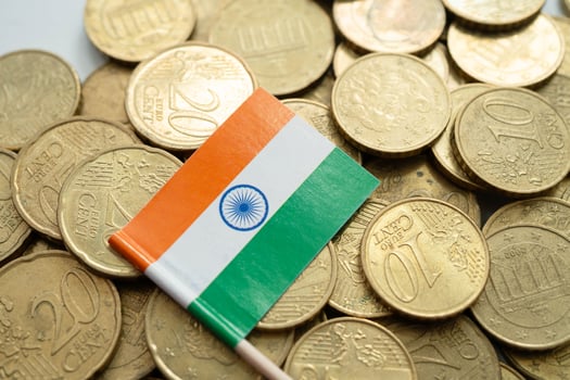 India flag on coins background, finance and accounting, banking concept. photo