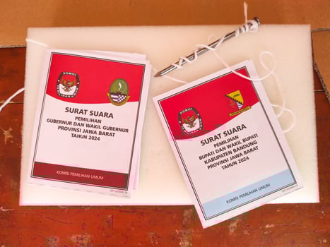 Cikancung, West Java, Indonesia - November 27, 2024. Ballot papers for the West Java Governor and Regent elections. Indonesian General Election. Regional Elections. Democracy and voting rights. photo