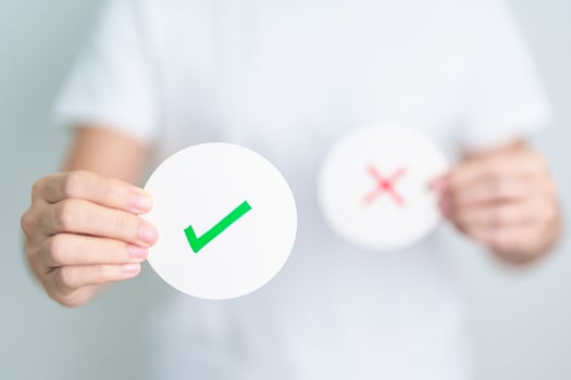 Woman show Right symbol paper. True and false, accept and rejected, evaluation, Vote, Poll, Yes or No and Survey concepts photo