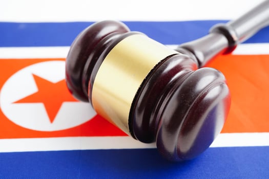 North Korea, Legal, justice and agreement, wooden court gavel on flag. photo