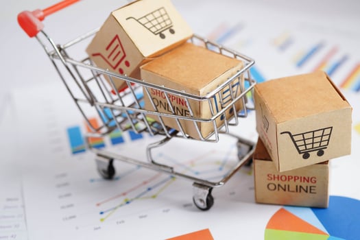 Online shopping, Shopping cart box on business graph, import export, finance commerce. photo