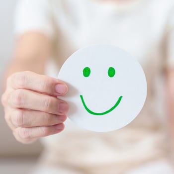 Woman show Happy Smile face paper, Mental health Assessment, Psychology, Health Wellness, Feedback, Customer Review, Experience, Satisfaction Survey, Positive Thinking and World Mental Health day photo