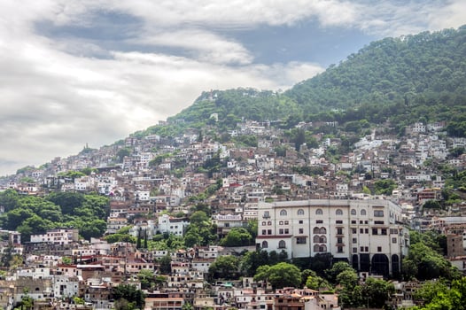 Taxco hillside architecture and vibrant communities under a clear sky photo