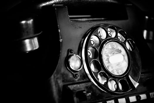 Old, retro and vintage landline rotary telephone in noir style photo