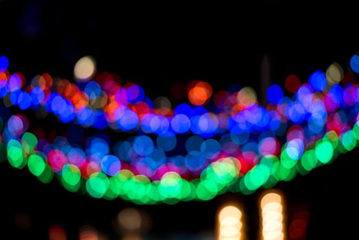 Colorful Christmas garland blurred and defocused with bokeh photo