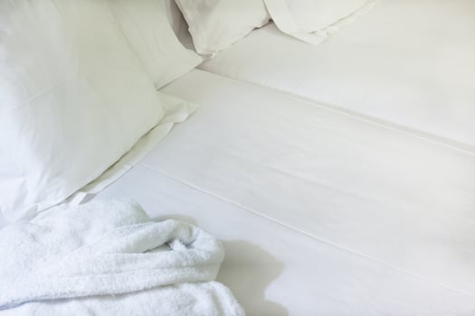Night scene in hotel room prepared fresh bed photo