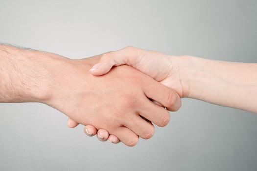 Shaking hands of two people photo