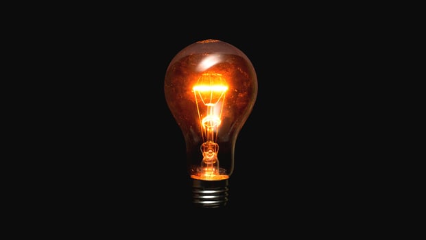 Light bulb on a black background photo