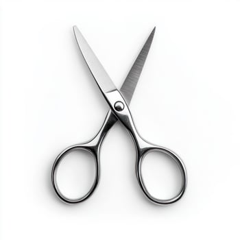 A pair of sharp stainless steel scissors on a white background. isolated on white background. photo