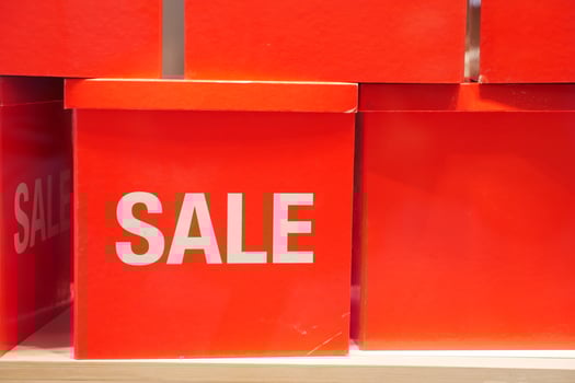 Bright and EyeCatching Red Sale Boxes are Displayed on a Shelf for Maximum Attraction photo