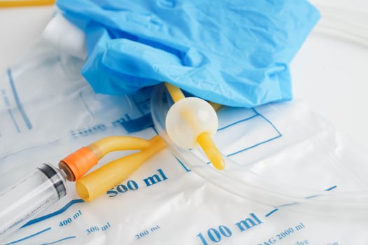 Foley catheter and urine drainage bag collect urine for disability or patient in hospital. photo