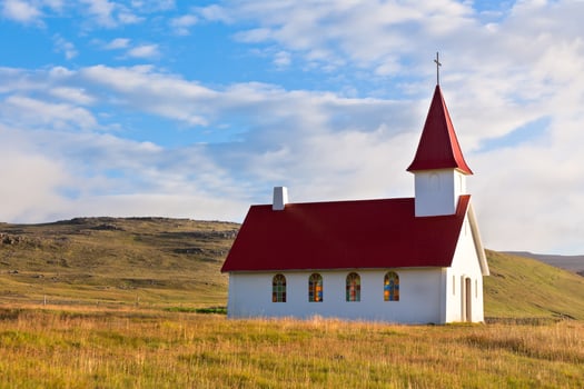 Typical Rural Icelandic Church under a blue summer sky photo