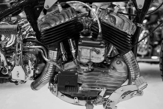Closeup image twins old engine of 1970's classic Chopper motorbike in black tone photo