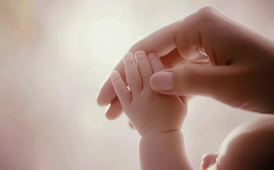 Close-up little hand of child baby holding hand of mother, A newborn holds on to mom's, dad's finger, Love and relationship with infant, Care and support, Dreaming and protection. photo