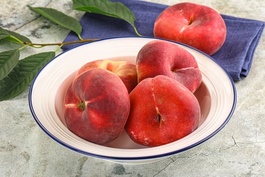 Ripe sweet and juicy Flat peach photo