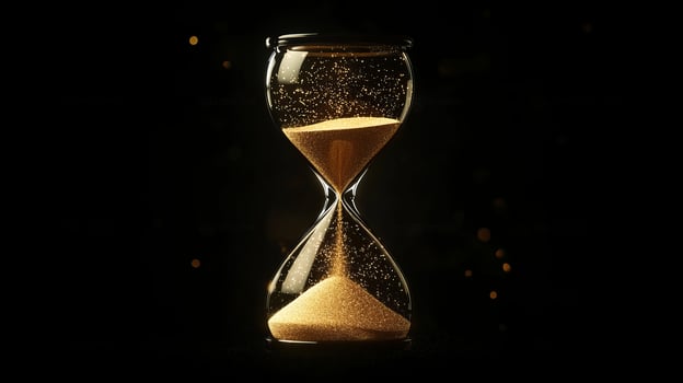 An hourglass filled with shimmering golden sand, set against a deep black background, serves as an elegant depiction of the relentless and continuous flow of time, emphasizing its fleeting nature photo