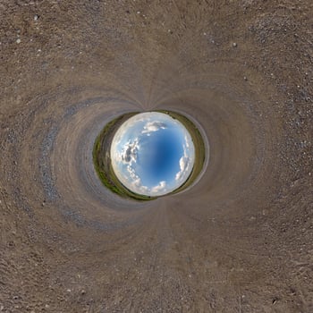 blue hole sphere or globe little planet inside green dry grass or stone with sand frame background photo