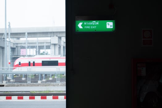 Emergency exit sign on the platform of the railway repair station. photo