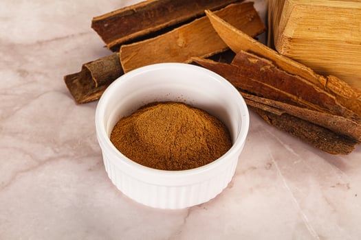 Natural Cinnamon powder with sticks photo