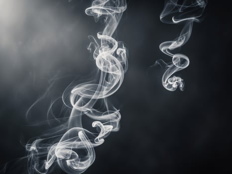 Abstract smoke swirls in a mysterious black background. photo