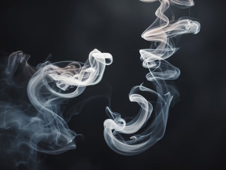 Abstract smoke swirls in a mysterious black background. photo
