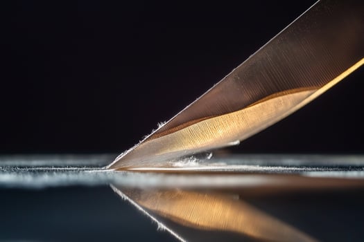 Knife Slicing Through a Fresh Piece photo