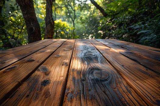 Rustic Wooden Table in Sunlit Forest Setting for Natural Design Inspiration photo