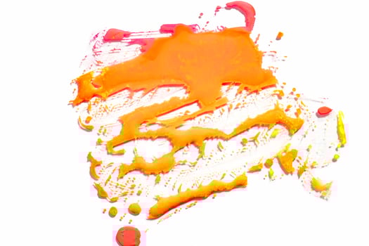 Abstract vibrant orange wet paint drops and splotch on white background. Bright neon colors. Street art isolated photo