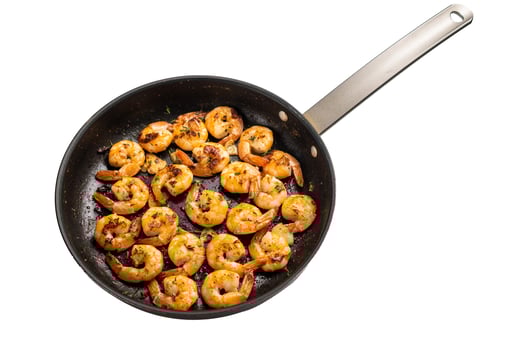 Grilled Jumbo Shrimps Prawns Sauteeing in Butter and Olive Oil isolated on white background. photo