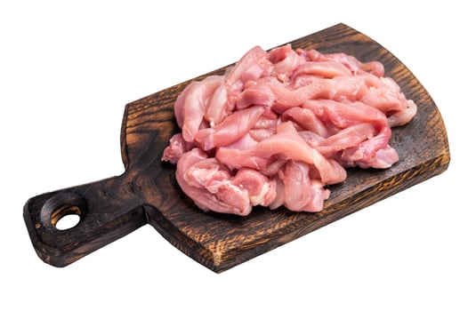 Raw sliced Chicken meat, strips fillets on wooden board isolated on white background photo