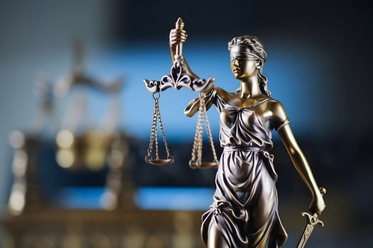 Lady Justice statue with scales, blindfold, and sword, symbolizing fairness photo