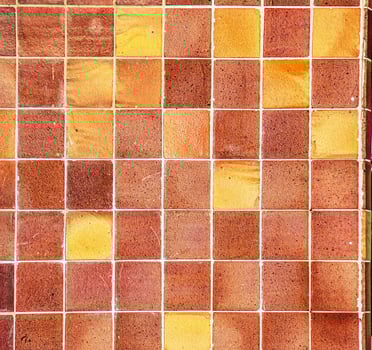 Ceramic tiles in orange tones. Background or texture photo