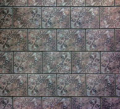 Ceramic tiles in purple-gray tones. Background or texture photo
