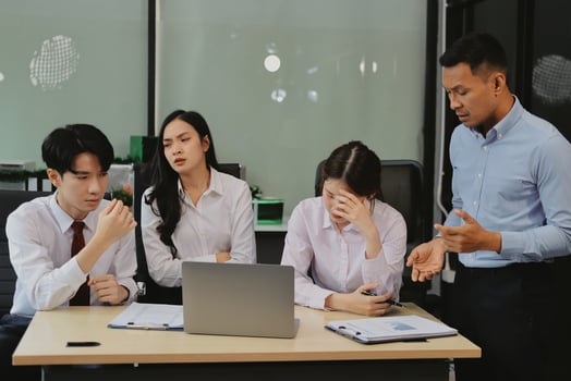 A group of business people in an office photo