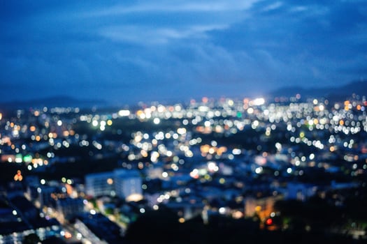 An abstract blurry image of a city skyline at sunset. photo