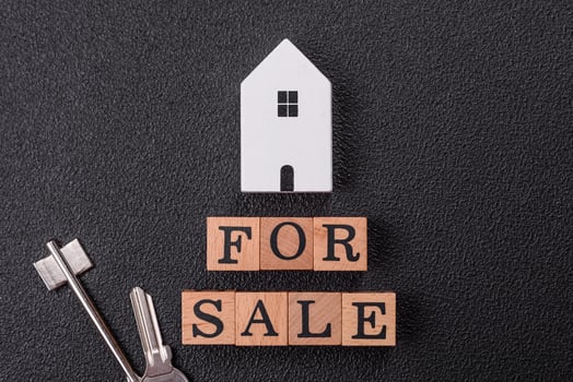 The inscription for sale laid out with wooden cubes photo