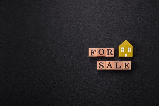 The inscription for sale laid out with wooden cubes photo