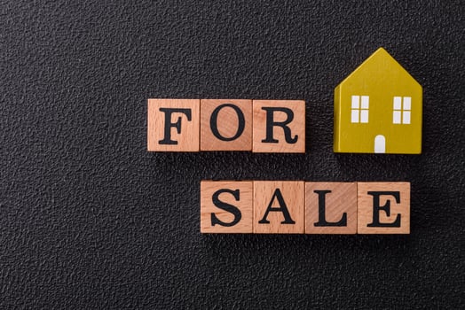 The inscription for sale laid out with wooden cubes photo