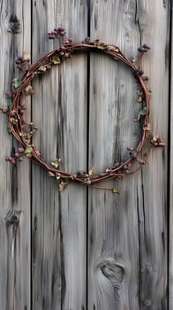 Grapevine stems curved into a circle on wood fence surface, wallpaper art photo