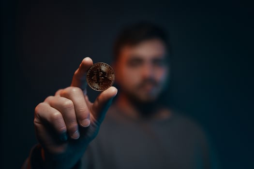 Man holding bitcoin. Financial ecosystem. The currency of the future. photo