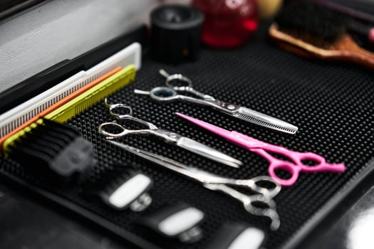 Tools arranged neatly on a stylist workstation in a hair salon photo