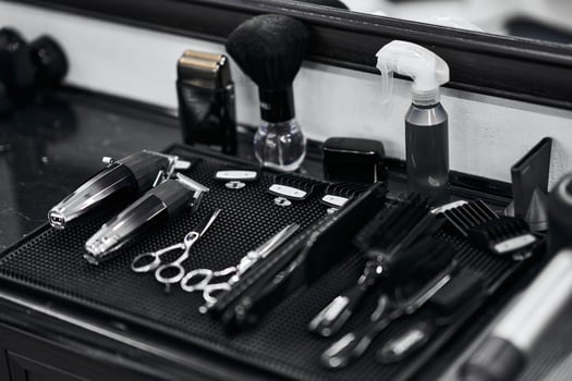 Tools and equipment arranged neatly on a barbers workstation for grooming tasks photo